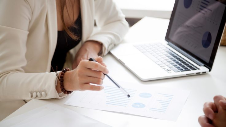 Analyzing new marketing plan and sales statistics concept, close