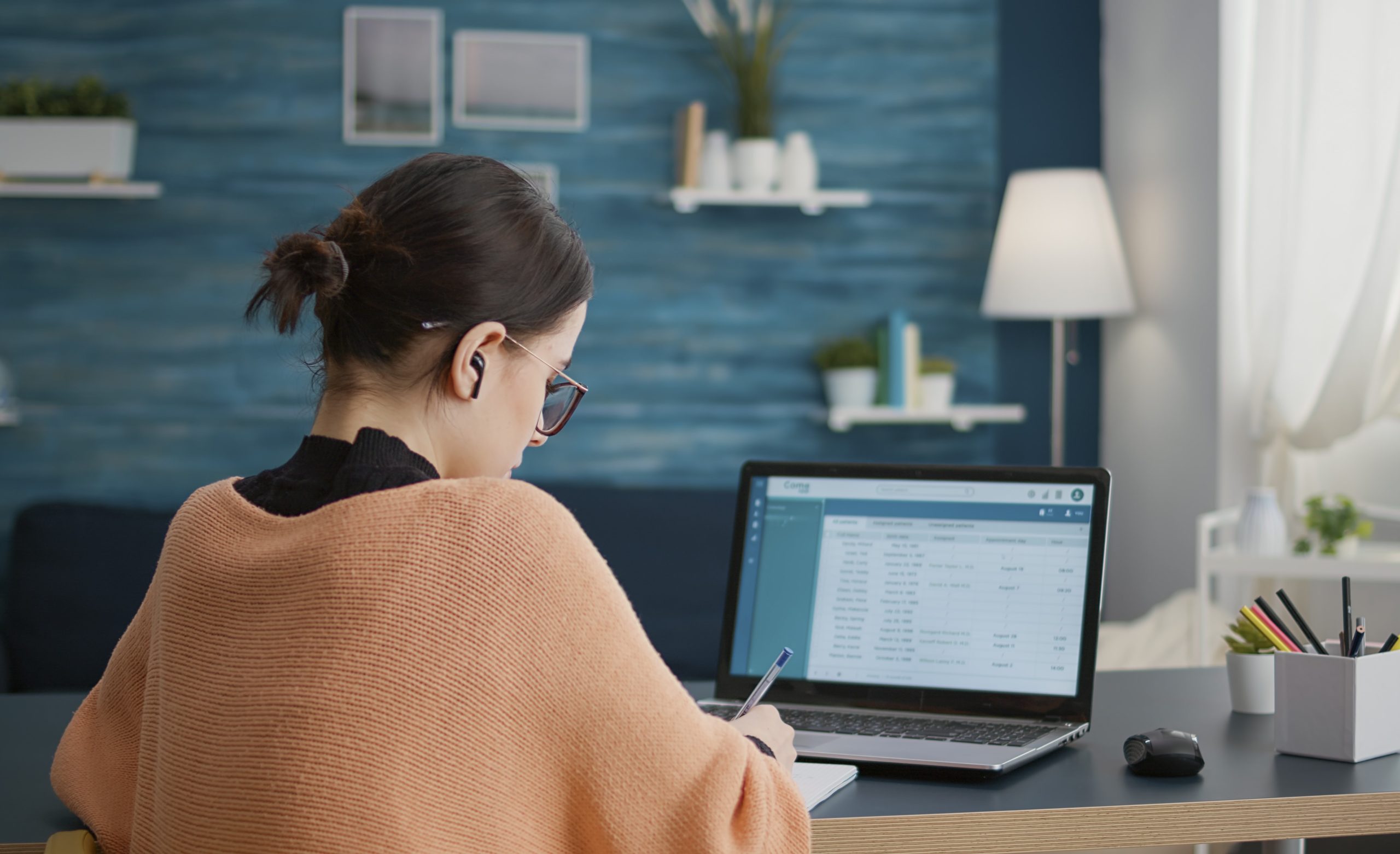 Student working form home on laptop to do internet research